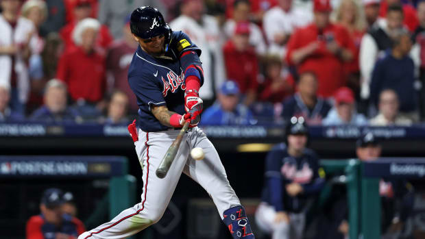 Oct 11, 2023; Philadelphia, Pennsylvania, USA; Atlanta Braves shortstop Orlando Arcia (11) hits an RBI single during the sixth inning against the Philadelphia Phillies in game three of the NLDS for the 2023 MLB playoffs at Citizens Bank Park.